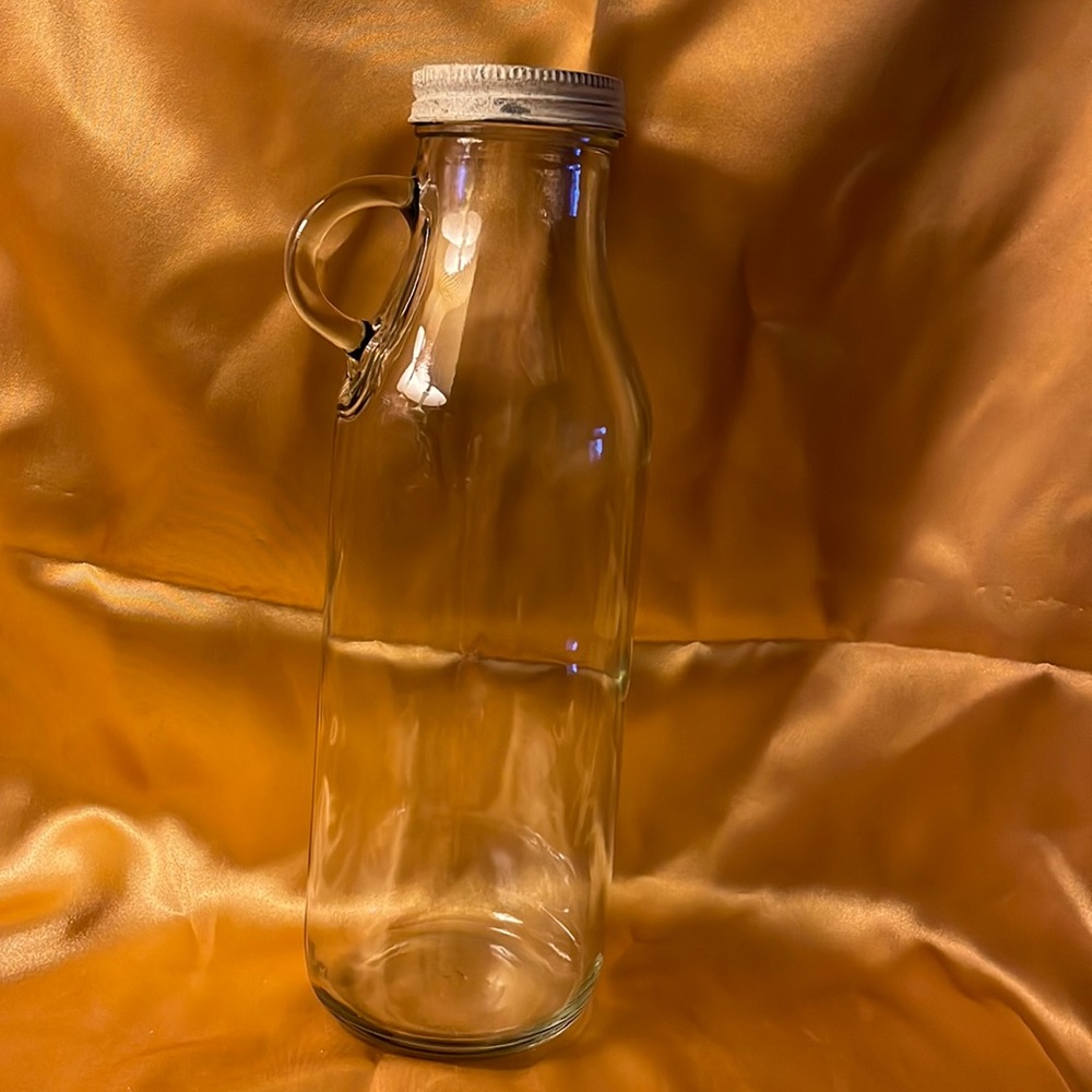 Glass milk bottle with handle on top of bottle & shabby chic cap. Vintage look